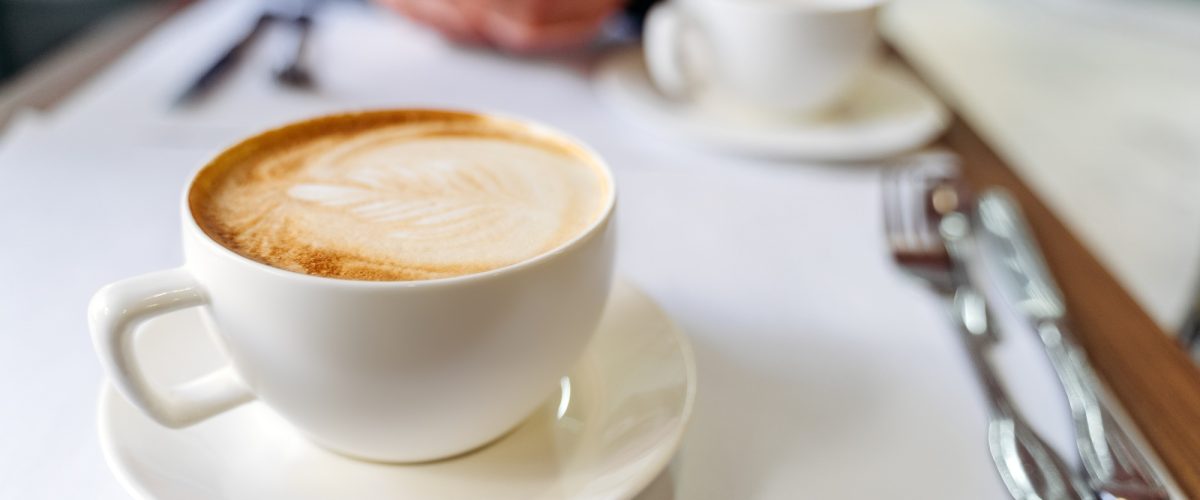 cup-with-coffee-on-the-table-in-a-coffee-shop-45WM2BT
